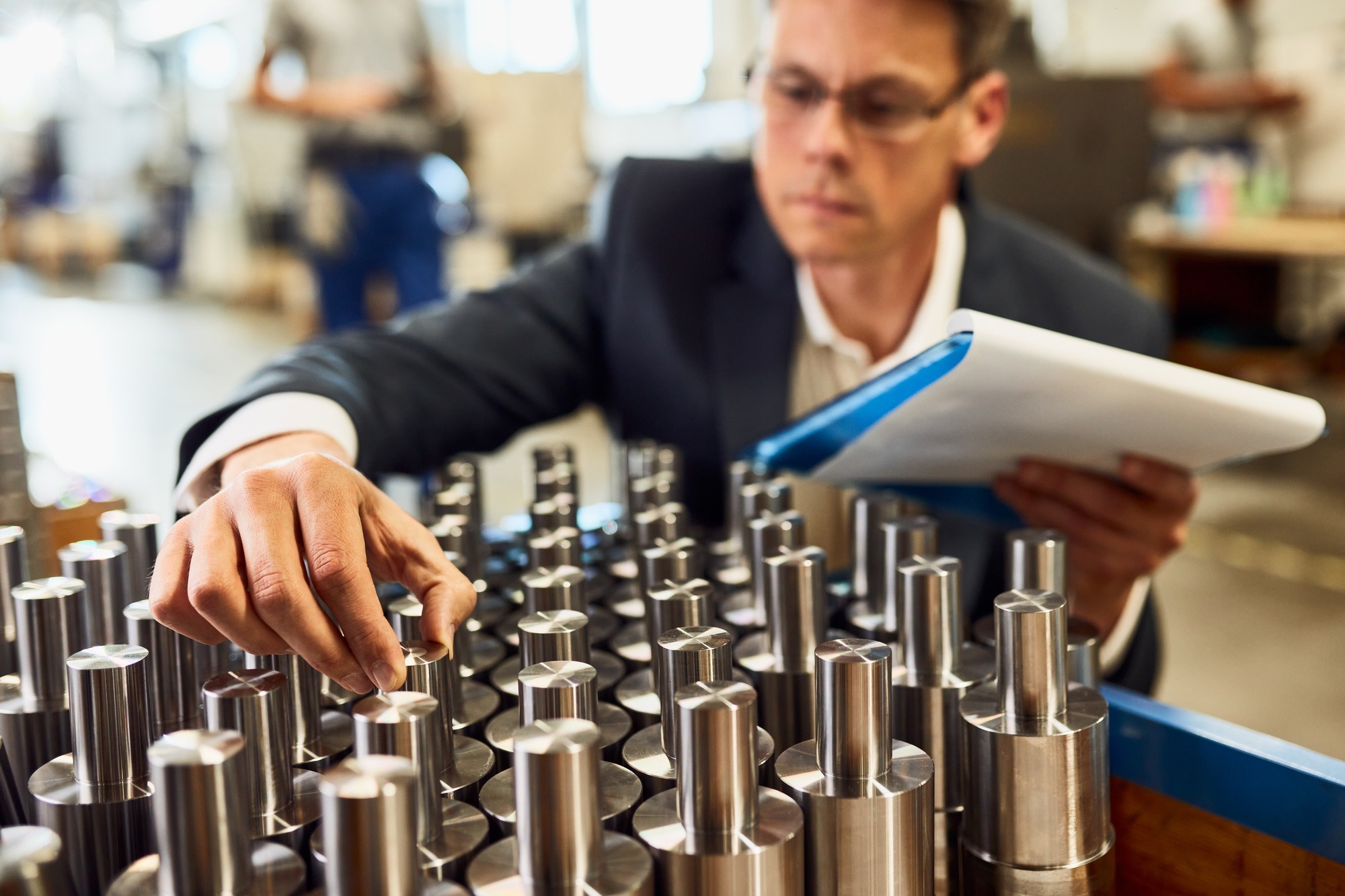 Close-up of engineer in doing quality control at streel factory.